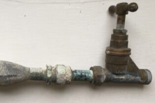 A lead pipe showing a swollen 'lead wipe' joint