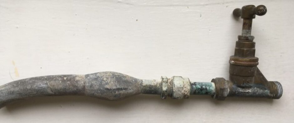A lead pipe showing a swollen 'lead wipe' joint