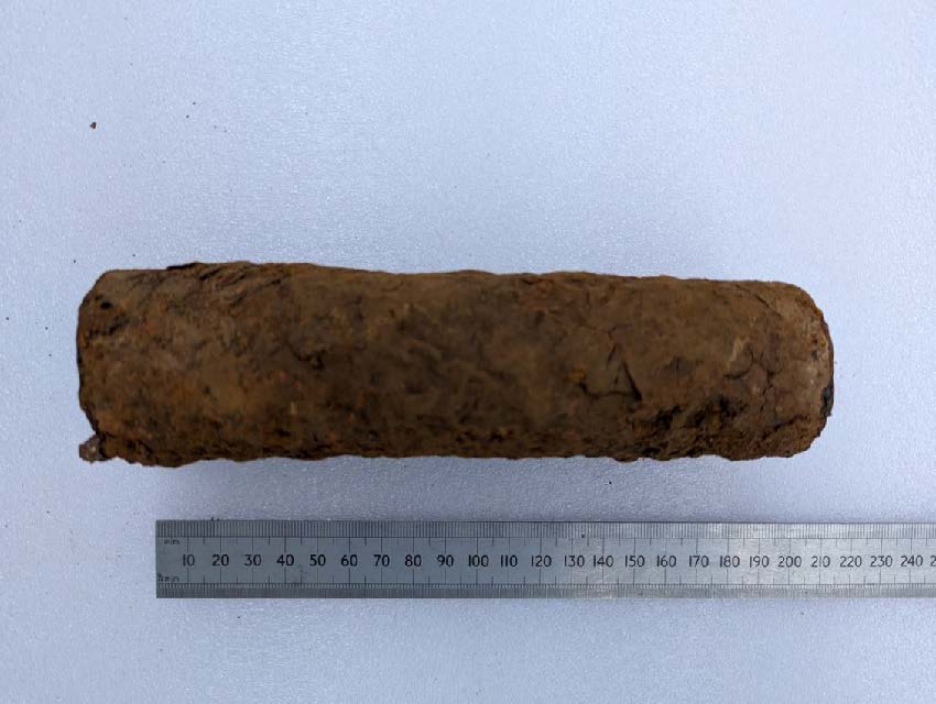 Section of a water pipe which was suspected of containing lead, the section is approximately 220 mm long and appears heavily corroded on the outside.
